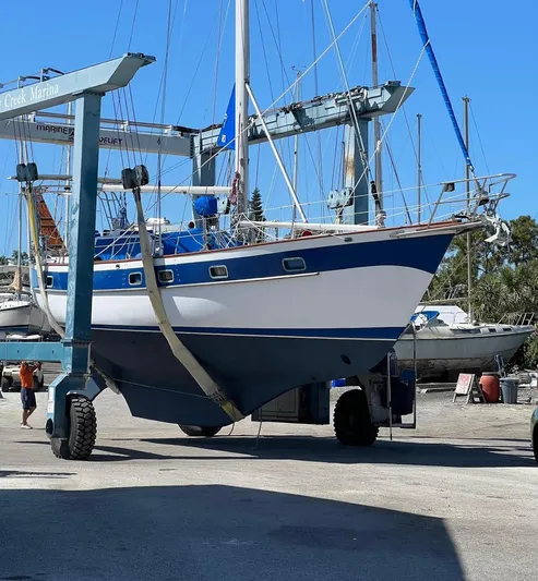 Aries Yacht Photos Pics 1982 Sea Star 46 sailboat in dry dock, undergoing maintenance under clear blue skies.
