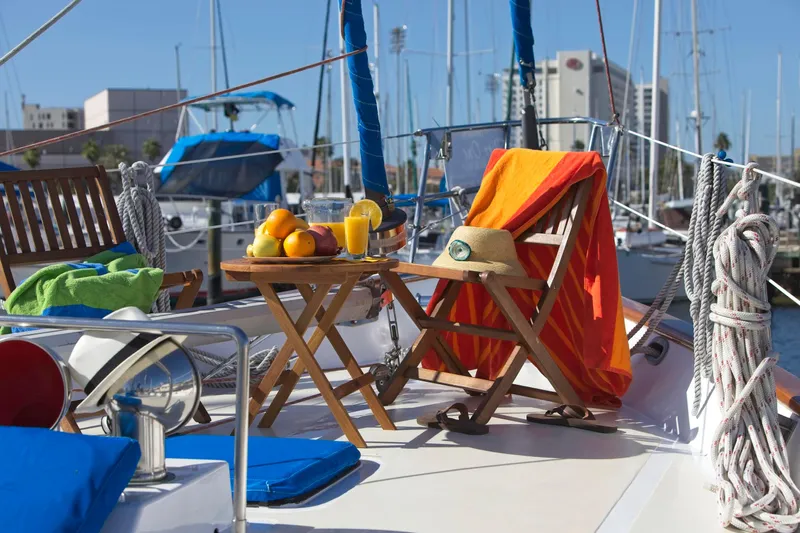 Aries Yacht Photos Pics Deck of 1982 Sea Star 46 yacht with fruit and drinks on a table.