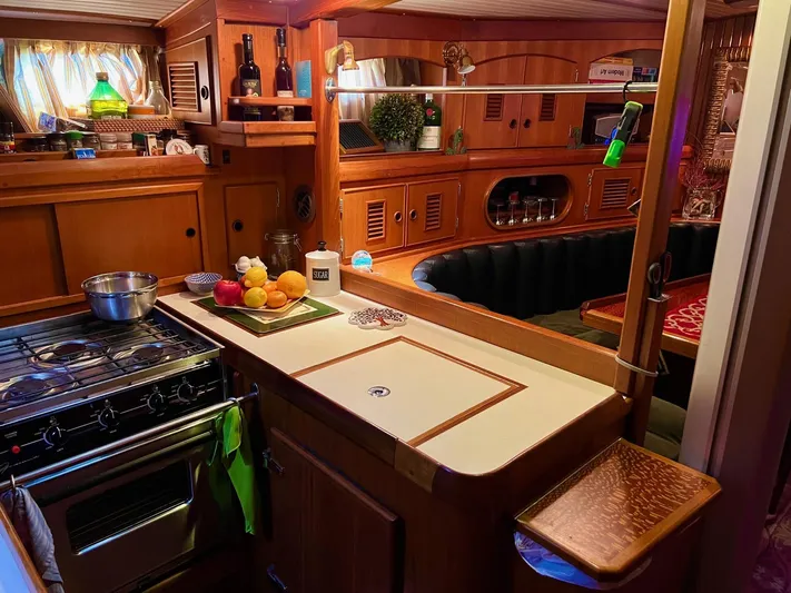 Aries Yacht Photos Pics Cozy 1982 Sea Star 46 yacht interior with wooden kitchen and dining area.
