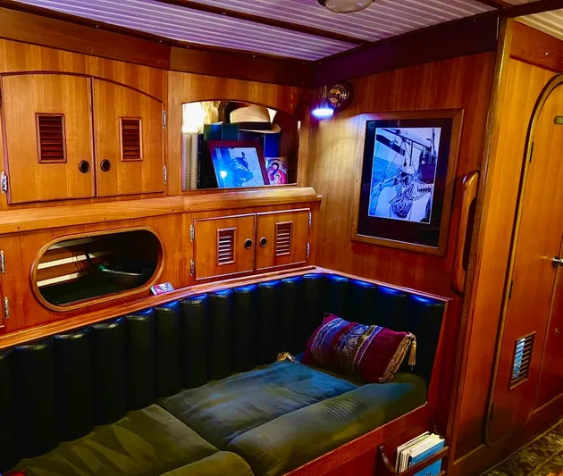 Aries Yacht Photos Pics Cozy 1982 Sea Star 46 yacht interior with wooden paneling and cushioned seating.