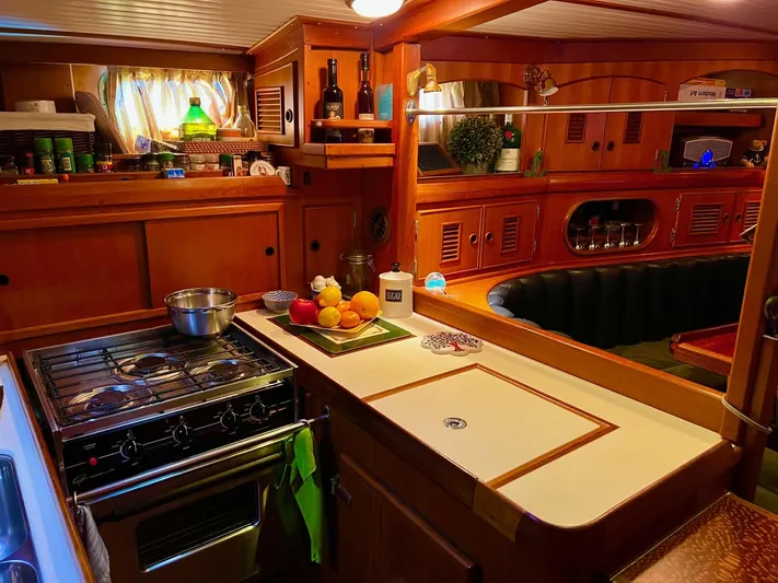 Aries Yacht Photos Pics Cozy 1982 Sea Star 46 yacht kitchen with wooden cabinetry and modern amenities.