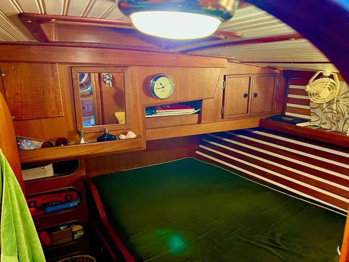 Aries Yacht Photos Pics Cozy cabin interior of 1982 Sea Star 46 yacht with wooden furnishings and nautical decor.
