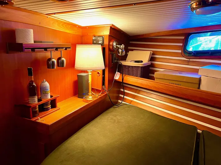 Aries Yacht Photos Pics Cozy cabin interior of 1982 Sea Star 46 yacht with warm lighting and wooden accents.