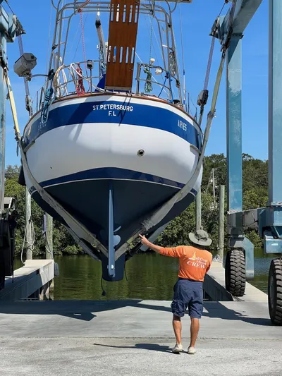 Aries Yacht Photos Pics 1982 Sea Star 46 sailboat being lifted at a marina in St. Petersburg, Florida.