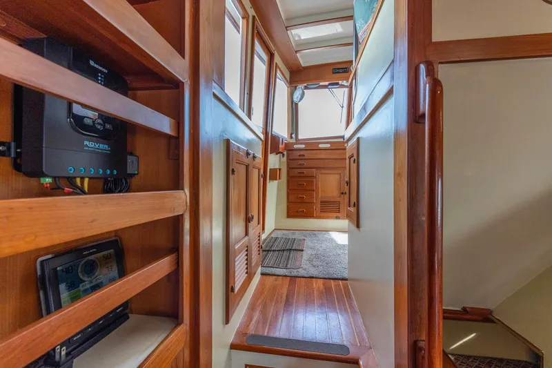 Points North III Yacht Photos Pics Interior of 1986 Kadey-Krogen 42 yacht with wooden cabinetry and modern electronics.