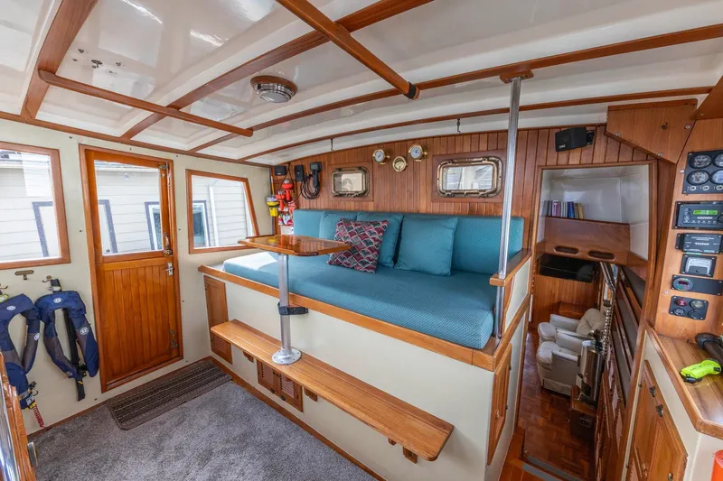 Points North III Yacht Photos Pics Interior of 1986 Kadey-Krogen 42 boat with wooden accents and cozy seating area.