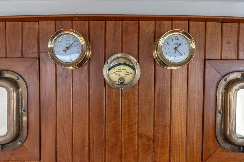 Points North III Yacht Photos Pics Wooden panel with brass clock and barometer on 1986 Kadey-Krogen 42 yacht.