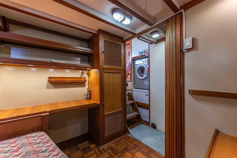 Points North III Yacht Photos Pics Interior of 1986 Kadey-Krogen 42 yacht with wooden desk, shelves, and laundry area.