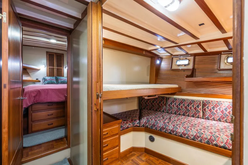 Points North III Yacht Photos Pics 1986 Kadey-Krogen 42 yacht interior with cozy wooden cabin and bunk beds.