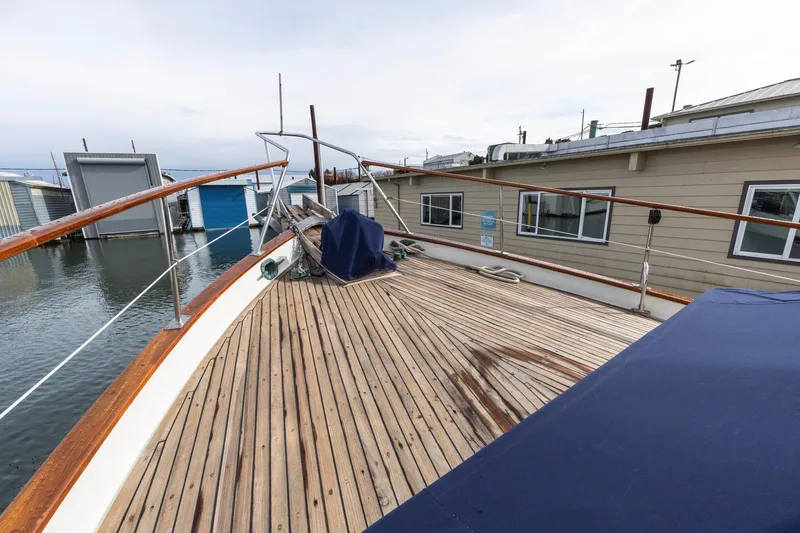 Points North III Yacht Photos Pics 1986 Kadey-Krogen 42 yacht deck with wooden finish, docked near houseboats.