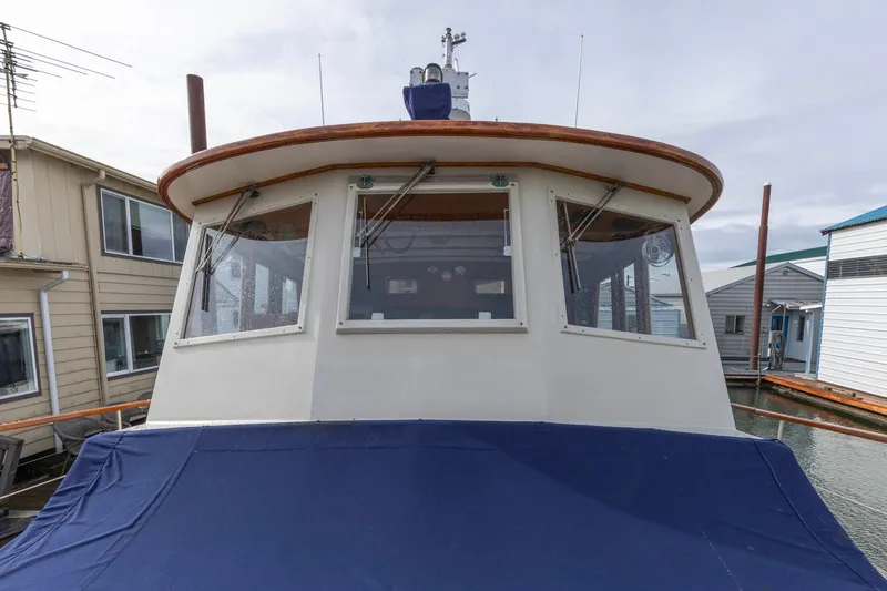 Points North III Yacht Photos Pics 1986 Kadey-Krogen 42 boat docked, featuring a covered deck and large windows.