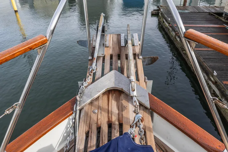 Points North III Yacht Photos Pics Bow of 1986 Kadey-Krogen 42 yacht with anchor and wooden deck details.