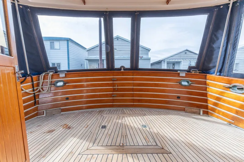 Points North III Yacht Photos Pics Interior view of 1986 Kadey-Krogen 42 boat with wooden deck and windows.