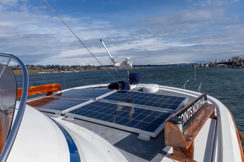 Points North III Yacht Photos Pics 1986 Kadey-Krogen 42 boat with solar panels on deck, cruising on a sunny day.