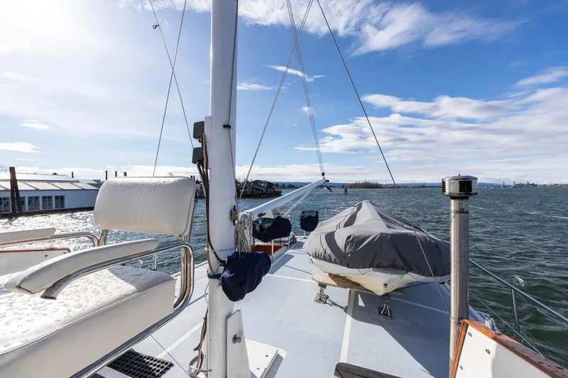 Points North III Yacht Photos Pics 1986 Kadey-Krogen 42 yacht deck with seating, covered equipment, and ocean view.