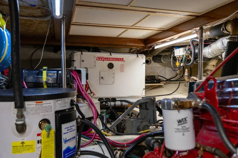 Points North III Yacht Photos Pics Engine room of 1986 Kadey-Krogen 42 with Westerbeke generator and various mechanical components.