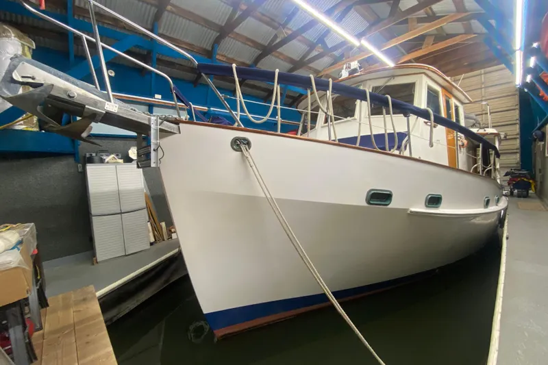 Points North III Yacht Photos Pics 1986 Kadey-Krogen 42 yacht docked indoors, showcasing sleek design and sturdy build.