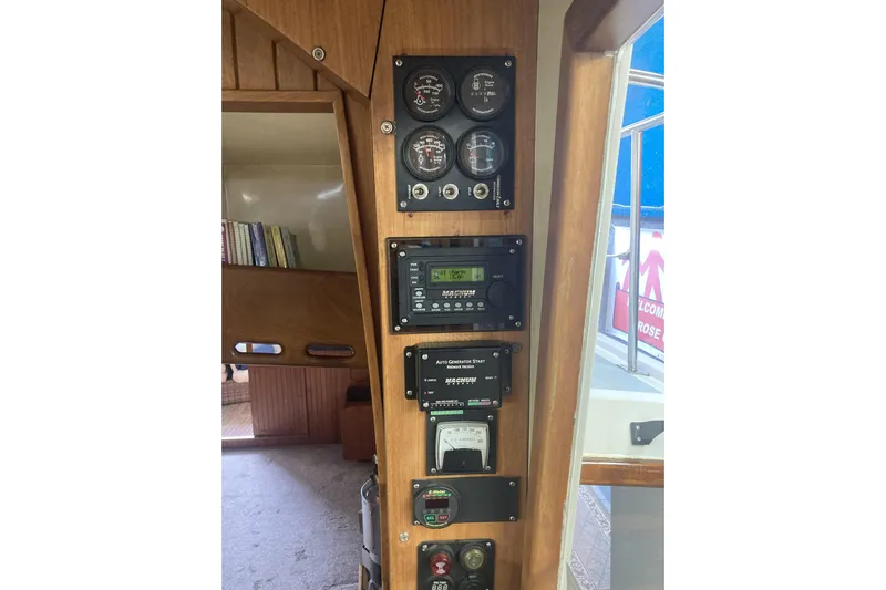 Points North III Yacht Photos Pics Control panel of a 1986 Kadey-Krogen 42 boat with gauges and meters.