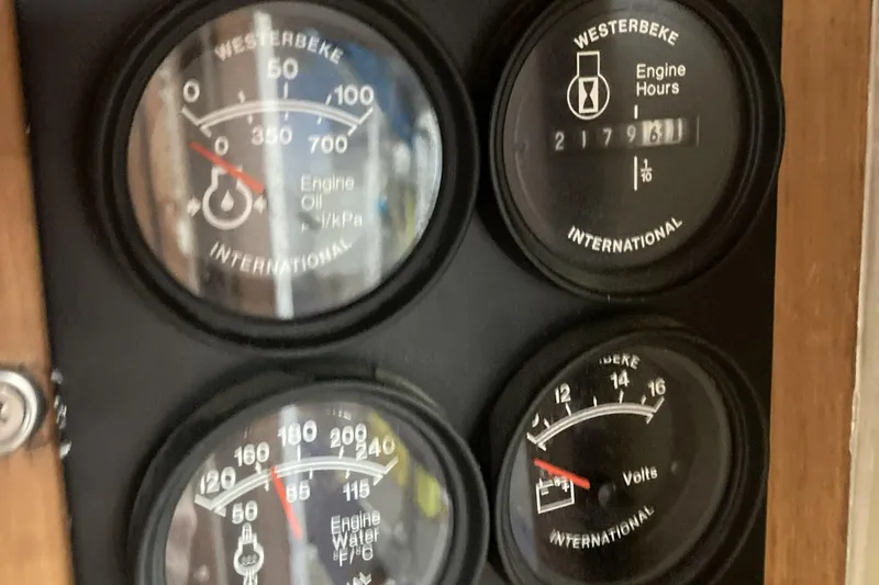 Points North III Yacht Photos Pics Close-up of Kadey-Krogen 42 engine gauges, displaying oil pressure, engine hours, water temperature, and voltage.