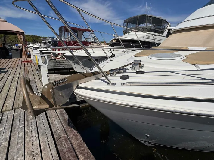  Yacht Photos Pics 2002 Carver 466 Motor Yacht docked, featuring a Rocna anchor on the bow.