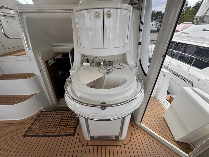  Yacht Photos Pics 2002 Carver 466 Motor Yacht interior with sink and wooden flooring.