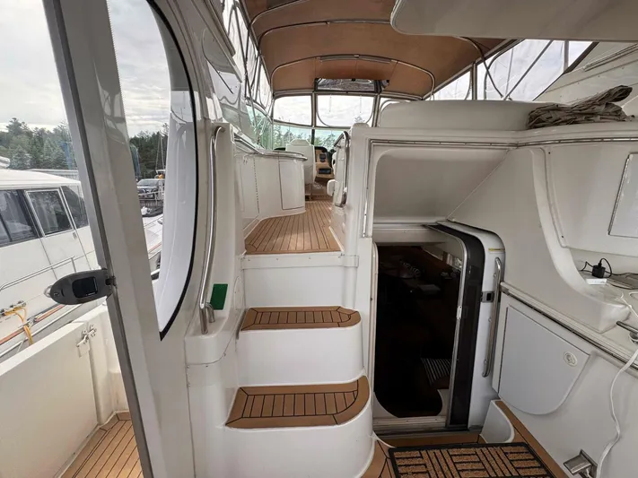  Yacht Photos Pics 2002 Carver 466 Motor Yacht interior with wooden steps and spacious cabin.