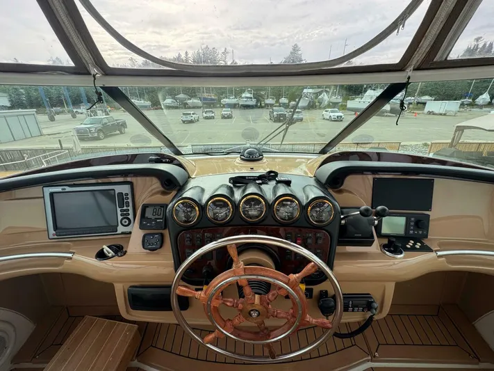  Yacht Photos Pics Helm of 2002 Carver 466 Motor Yacht with gauges and navigation equipment.