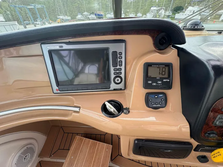 Yacht Photos Pics Dashboard of a 2002 Carver 466 Motor Yacht with navigation and depth display.