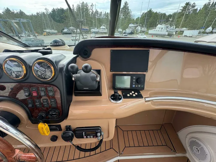  Yacht Photos Pics 2002 Carver 466 Motor Yacht helm with gauges, controls, and navigation equipment.