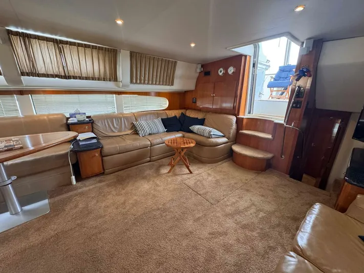  Yacht Photos Pics Luxurious interior of 2002 Carver 466 Motor Yacht with plush seating and elegant decor.