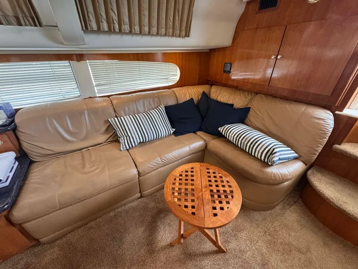  Yacht Photos Pics Luxurious interior of 2002 Carver 466 Motor Yacht with leather seating and striped cushions.