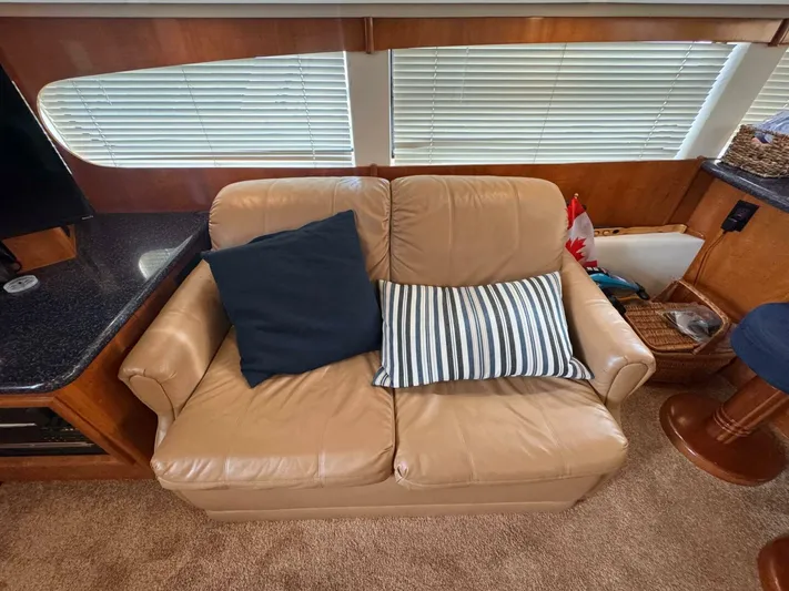  Yacht Photos Pics Leather sofa with cushions inside a 2002 Carver 466 Motor Yacht cabin.