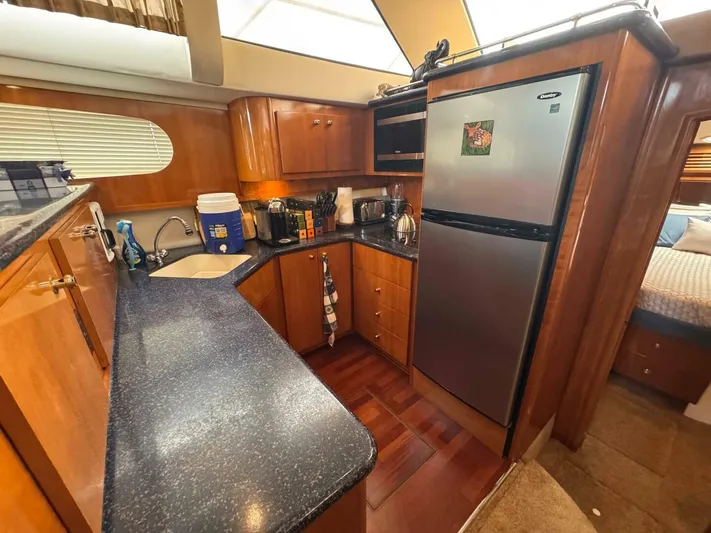  Yacht Photos Pics Luxurious kitchen interior of 2002 Carver 466 Motor Yacht with modern appliances.