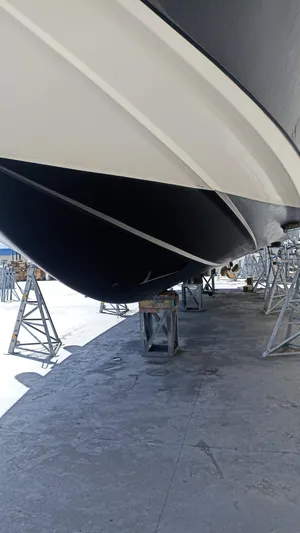  Yacht Photos Pics 2007 Azimut 62 yacht on dry dock, showcasing sleek hull design.