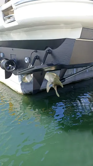  Yacht Photos Pics Close-up of a 2007 Azimut 62 yacht's propeller and stern in water.