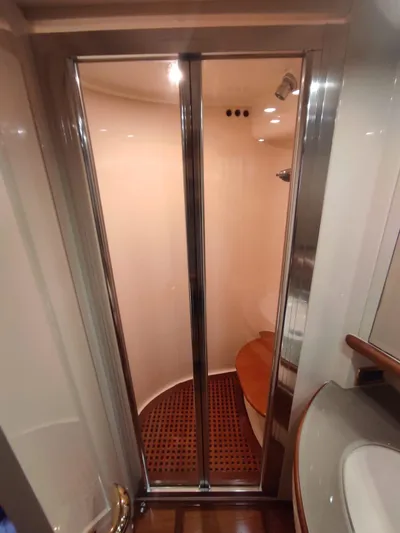  Yacht Photos Pics Shower area in 2007 Azimut 62 yacht with glass doors and wooden flooring.