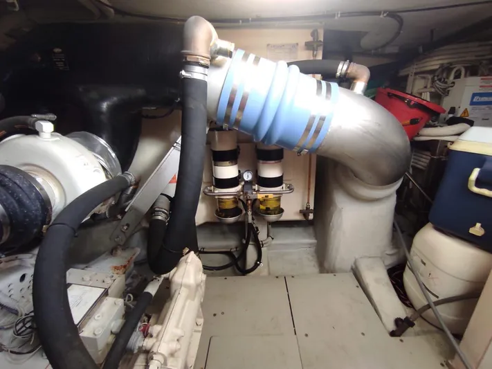  Yacht Photos Pics Engine room of a 2007 Azimut 62 yacht, featuring pipes and mechanical components.