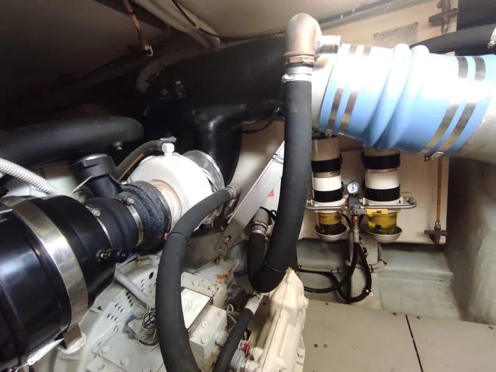  Yacht Photos Pics Engine room of a 2007 Azimut 62 yacht, showcasing mechanical components and piping.