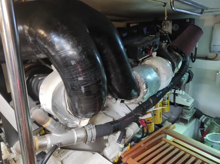  Yacht Photos Pics Engine room of a 2007 Azimut 62 yacht, featuring complex piping and machinery.