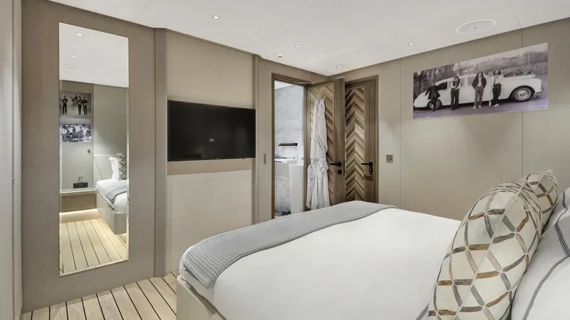 All About U Yacht Photos Pics Luxurious bedroom interior on 2018 Ada Yacht Sailing Yacht, featuring modern decor and elegant furnishings.