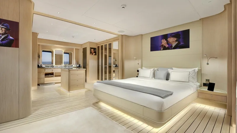 All About U Yacht Photos Pics Luxurious bedroom interior of 2018 Ada Yacht Sailing Yacht, featuring elegant decor and ambient lighting.