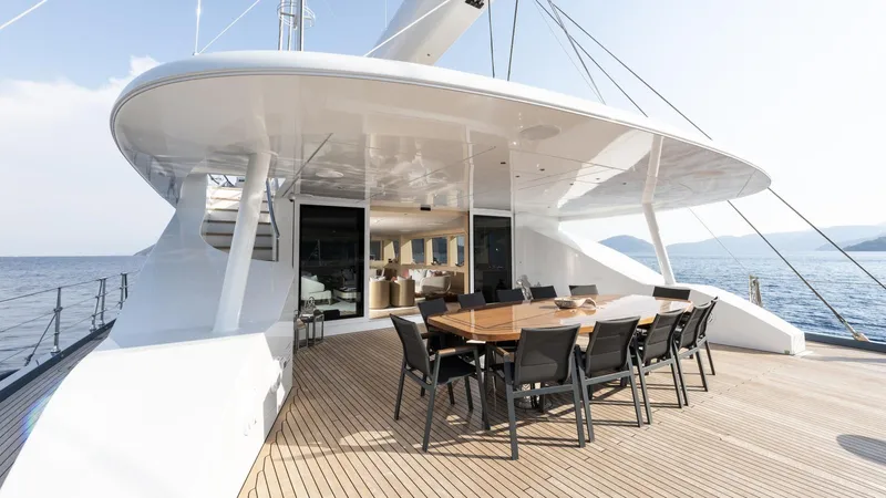 All About U Yacht Photos Pics Luxurious 2018 Ada Yacht sailing deck with elegant dining area and ocean view.