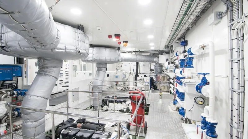 All About U Yacht Photos Pics Engine room of 2018 Ada Yacht Sailing Yacht, featuring complex piping and machinery.