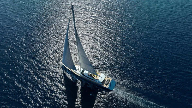 All About U Yacht Photos Pics Aerial view of 2018 Ada Yacht sailing on shimmering blue ocean.