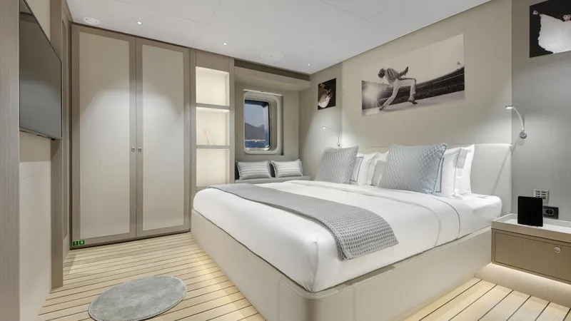 All About U Yacht Photos Pics Luxurious bedroom interior on 2018 Ada Yacht Sailing Yacht, featuring modern design and elegant decor.