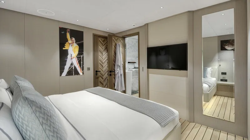 All About U Yacht Photos Pics Luxurious bedroom interior on 2018 Ada Yacht, featuring modern decor and stylish furnishings.