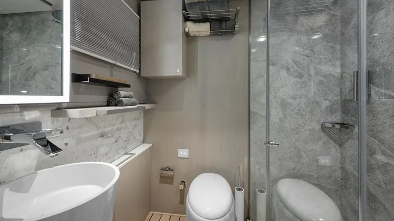 All About U Yacht Photos Pics Luxurious bathroom on 2018 Ada Yacht Sailing Yacht with modern fixtures and marble accents.