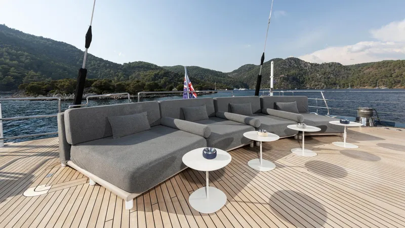 All About U Yacht Photos Pics Luxurious deck of 2018 Ada Yacht Sailing Yacht with modern seating and scenic ocean view.