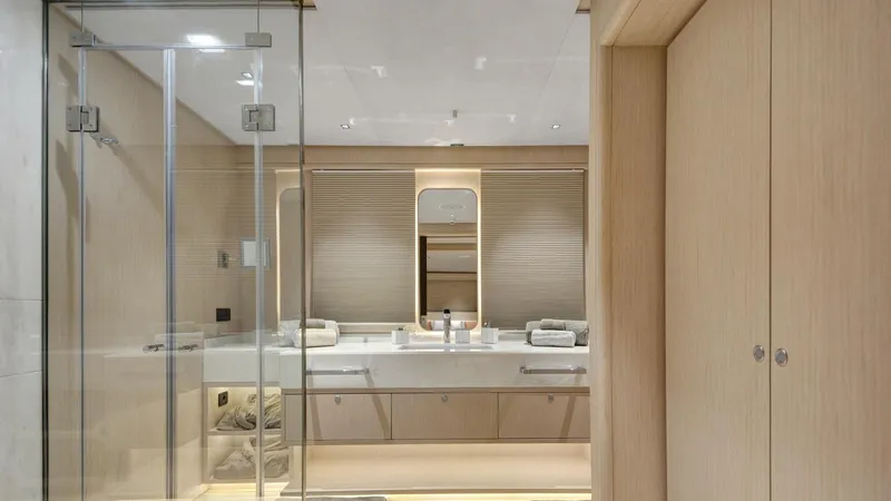 All About U Yacht Photos Pics Luxurious bathroom interior on 2018 Ada Yacht Sailing Yacht, featuring modern design and glass shower.