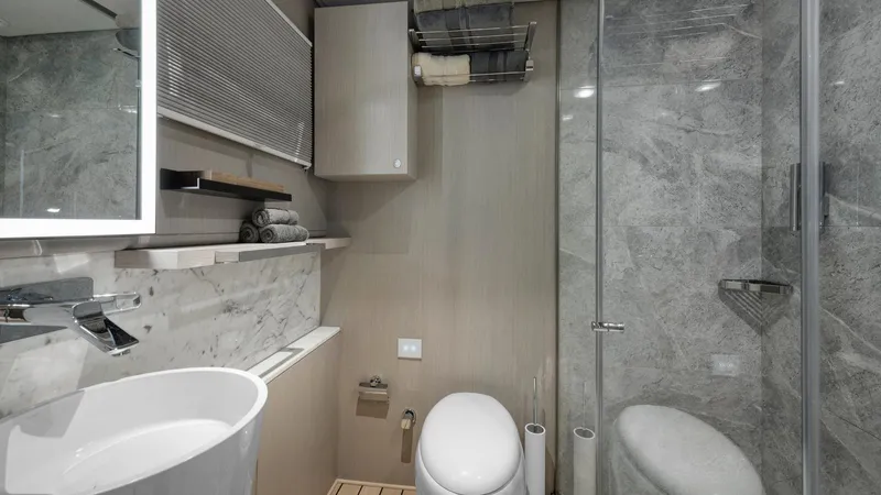 All About U Yacht Photos Pics Luxurious bathroom in 2018 Ada Yacht, featuring modern fixtures and elegant marble accents.